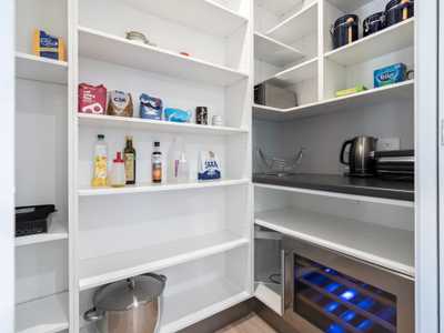 pantry with wine fridge